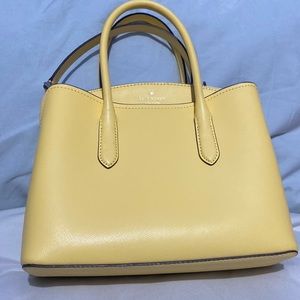 Kate Spade New York Satchel. Light yellow with crossbody strap.